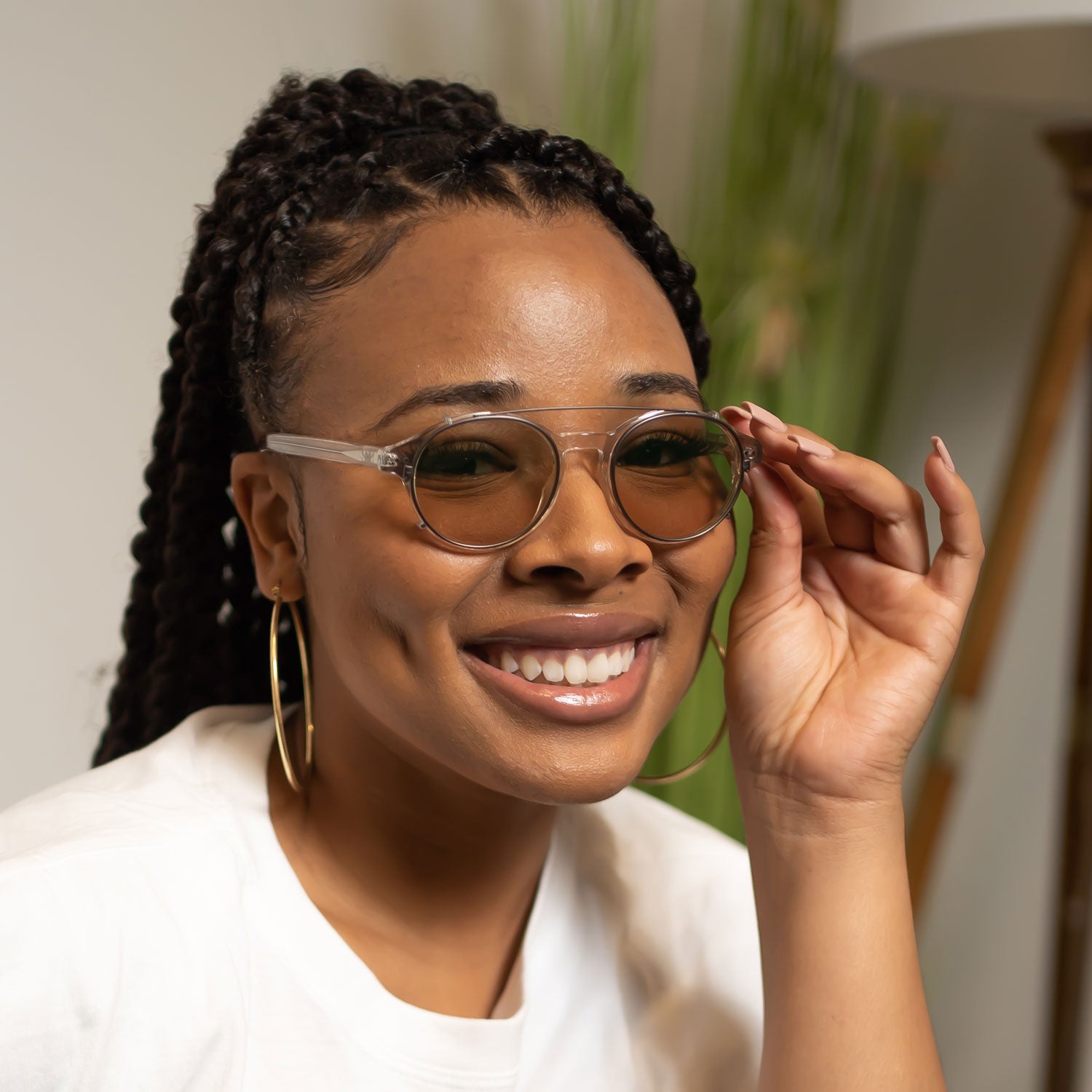 Woman wearing Avulux glasses for migraine and light sensitivity